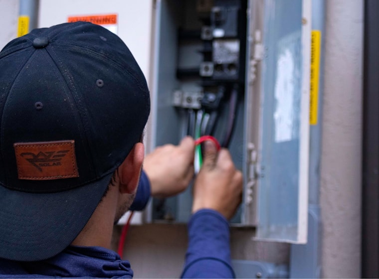 Coastline technician installing a new air conditioning unit